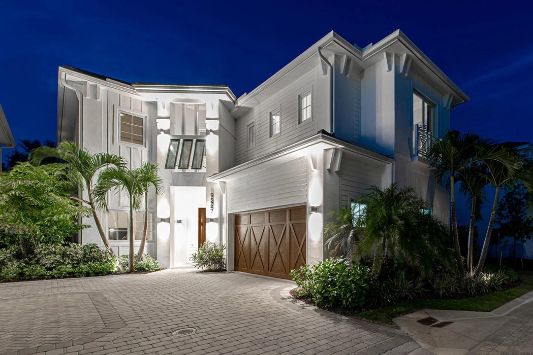 Exterior of a two story home with a two car garage at Residences at Mercato