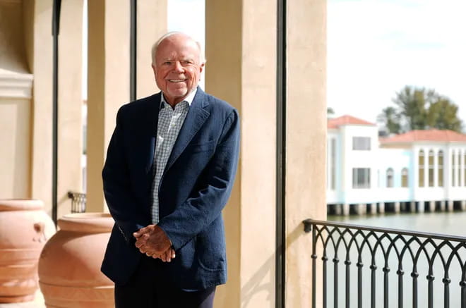 Scott Lutgert standing on a terrace.